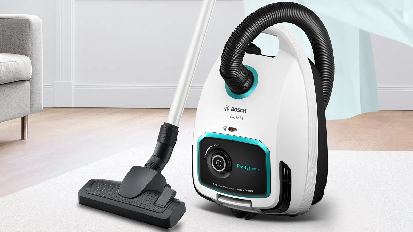 Vacuuming pet hair from a carpet with a powerful upright vacuum cleaner